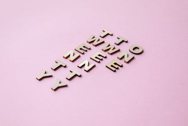 2021 words in wooden tiles on pink