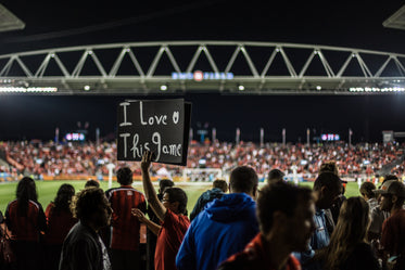 fan with sign at soccer game