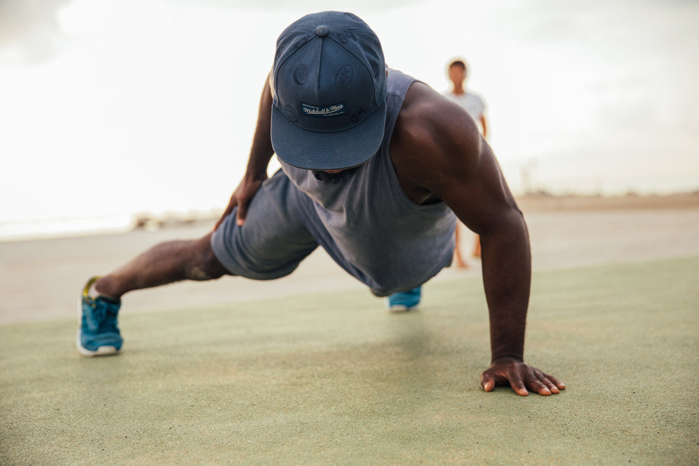 man doing one armed pushups