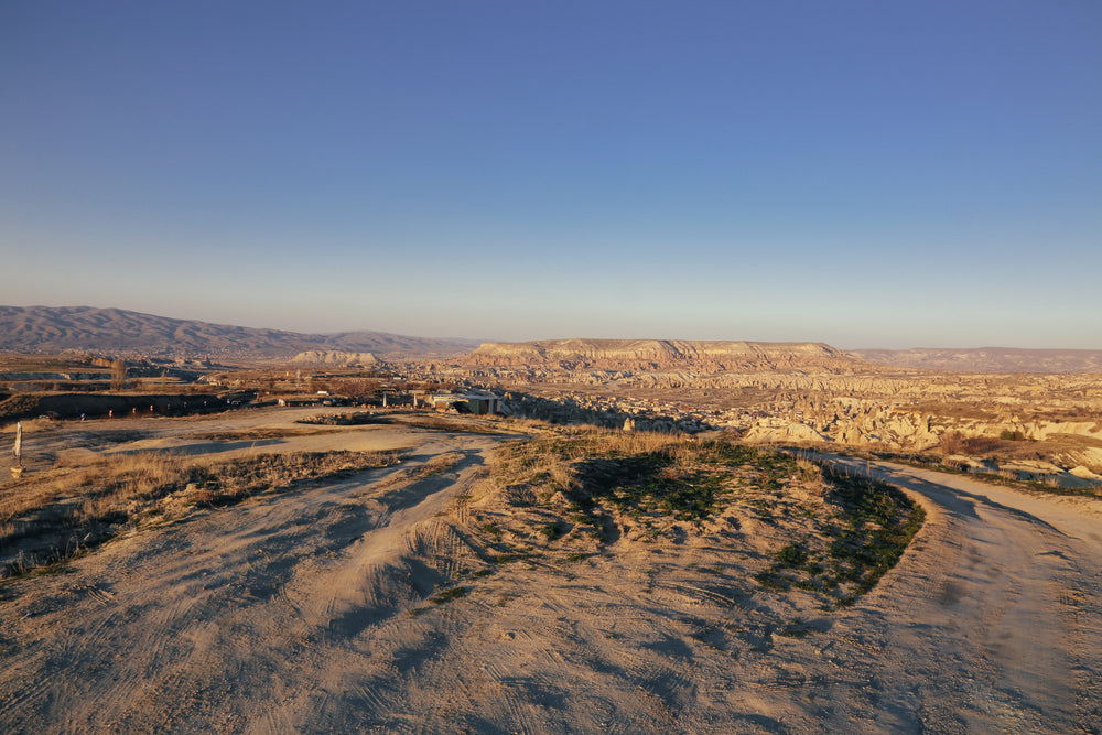 a bare landscape stretches so far