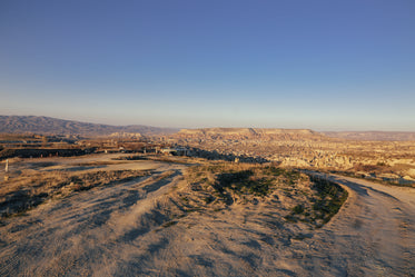 a bare landscape stretches so far