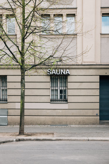 a barred window holds a sauna sign