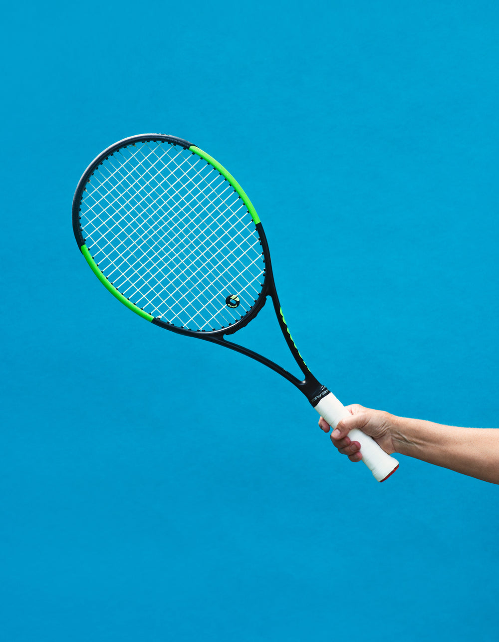 a black and green tennis racket