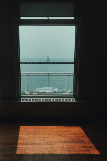 a boat through the window in the sun