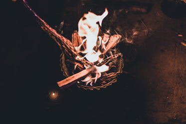 a bowl of kindling set aflame