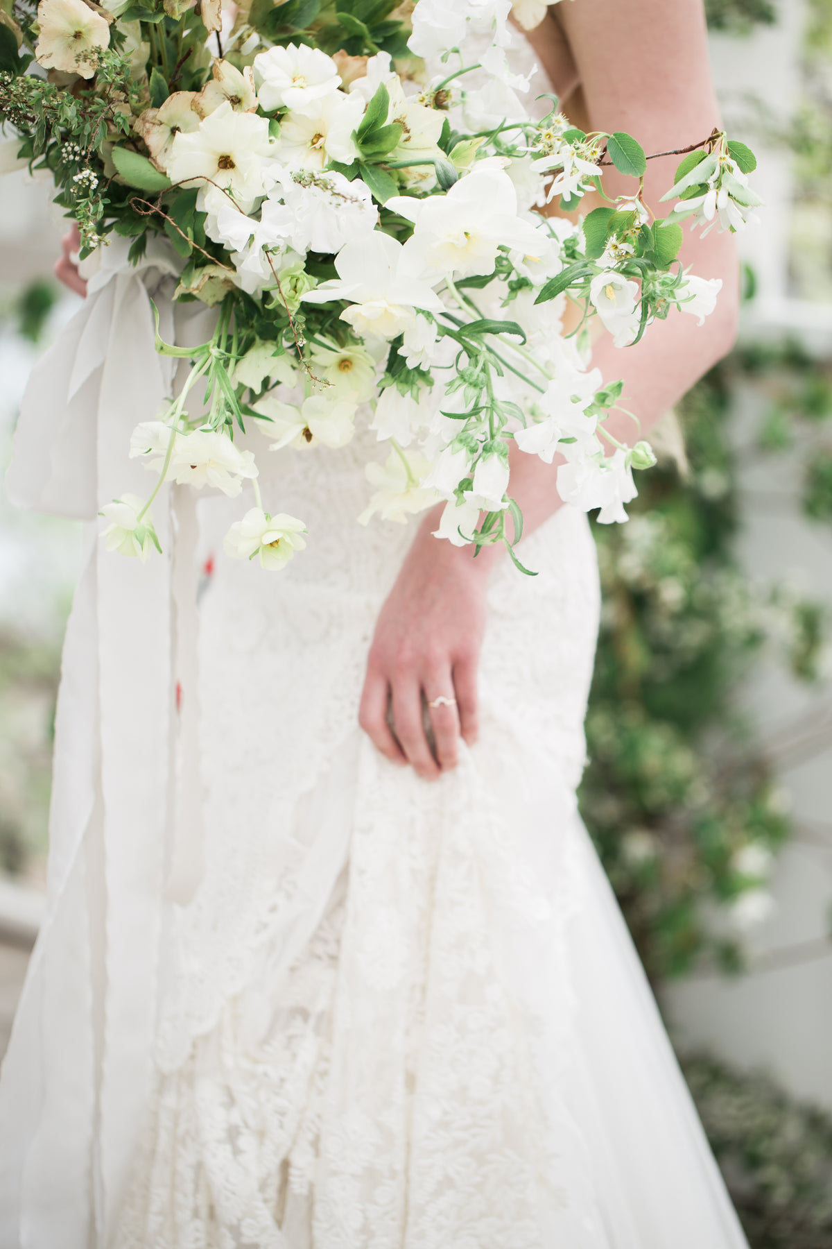 a brides dress and bouquet of flowers