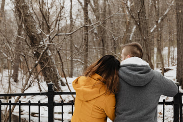 a bridge, a snowy forest, and romantic moment