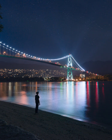 a city bridge illuminated at night