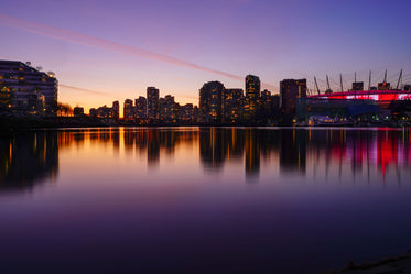 a city skyline under a sunset