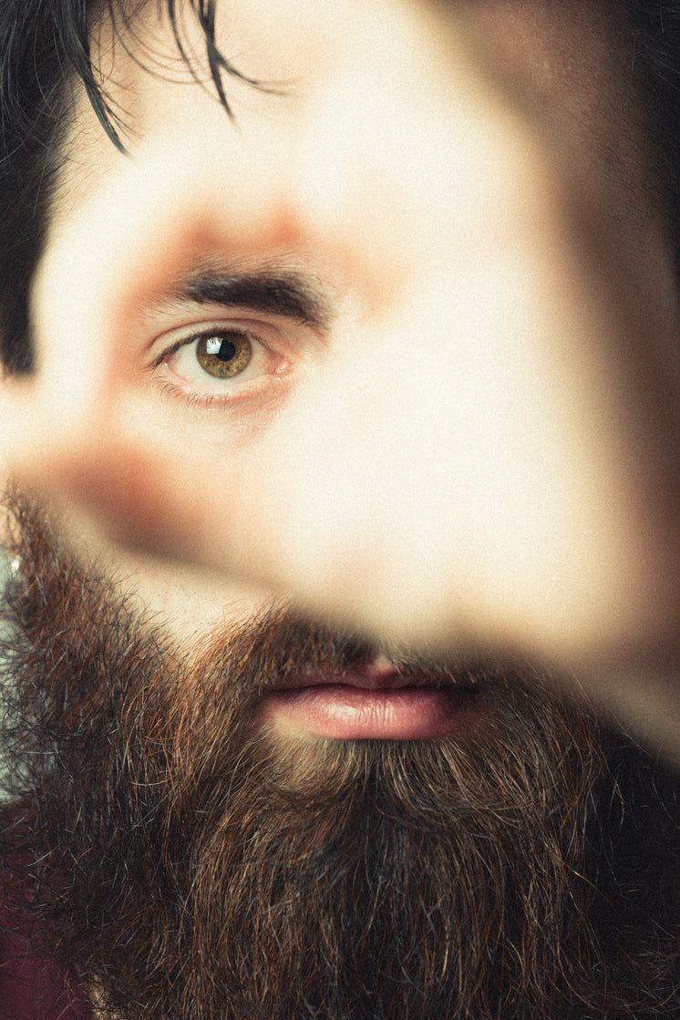 A Close Up Portait Of Someone Holding Their Hand Out