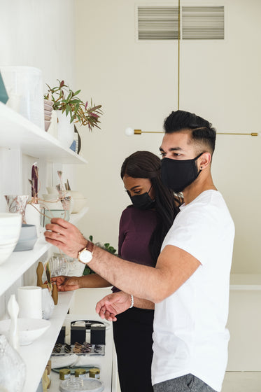 a couple shops while wearing face masks