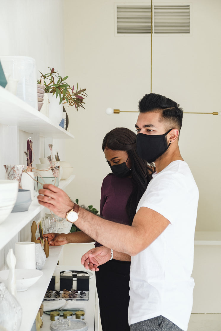 A Couple Shops While Wearing Face Masks