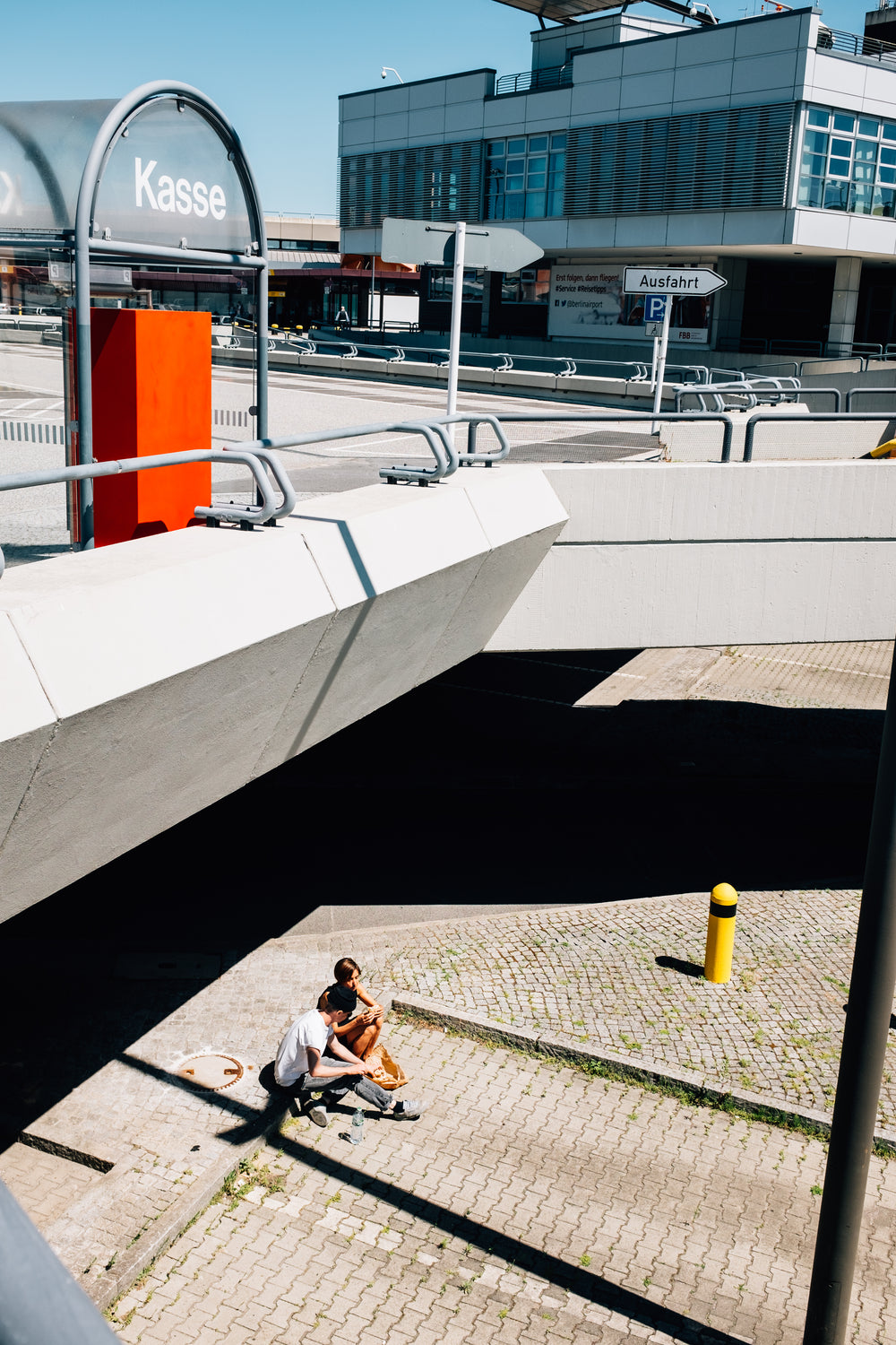 a couple under a bridge taking a break