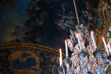 a crystal chandelier hangs in a corner