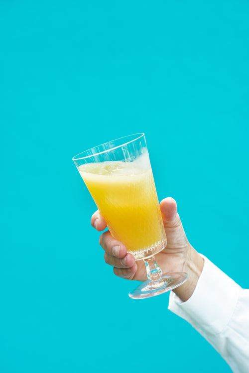 a crystal glass of orange juice