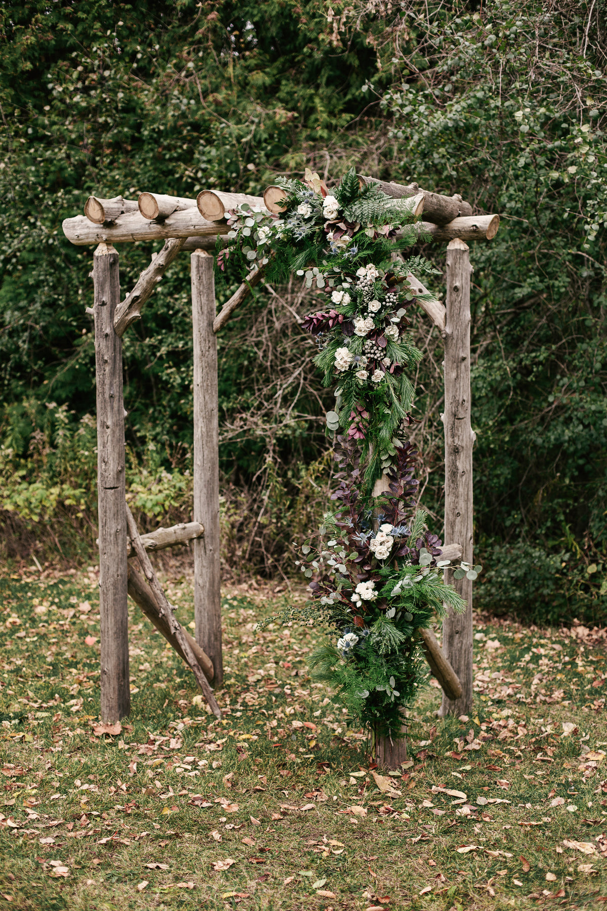 a custom flowered wedding archway