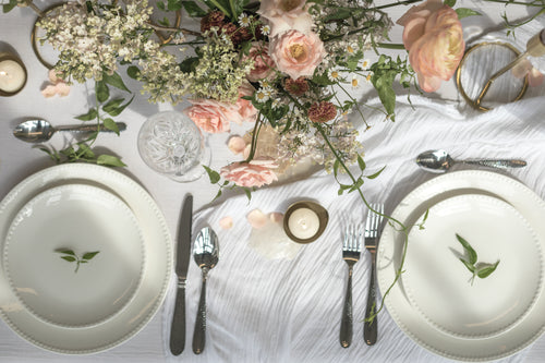 a dining table filled with floral decoration