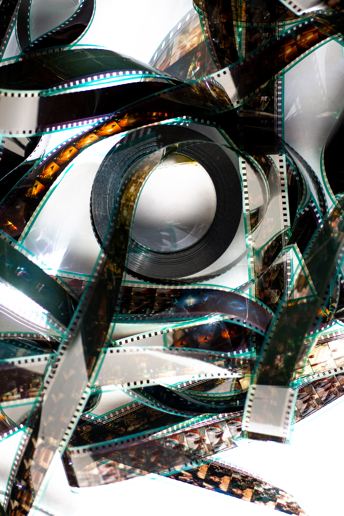 a film reel lays flat catching the sunlight