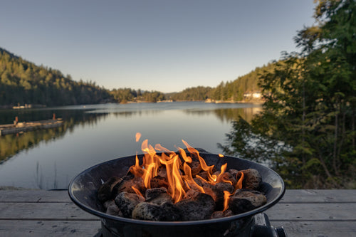 a fire by the lake