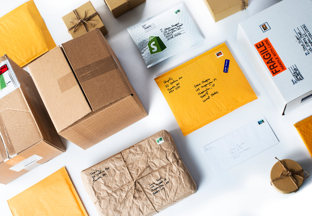 a flatlay of packages on white table