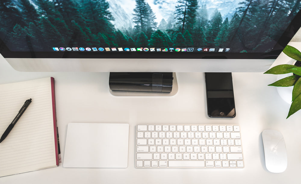 a flatlay view of a minimalist workspace