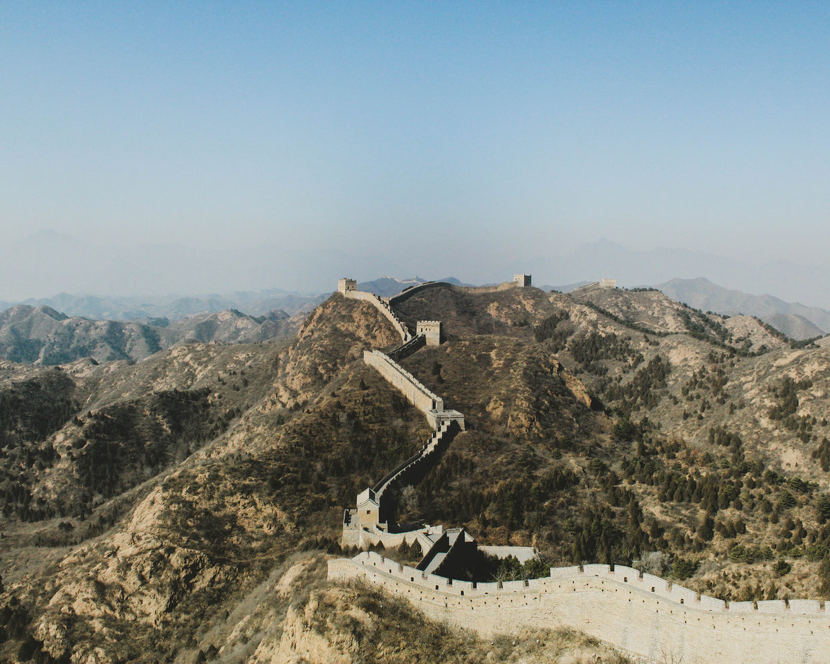 a great wall moves across the mountains