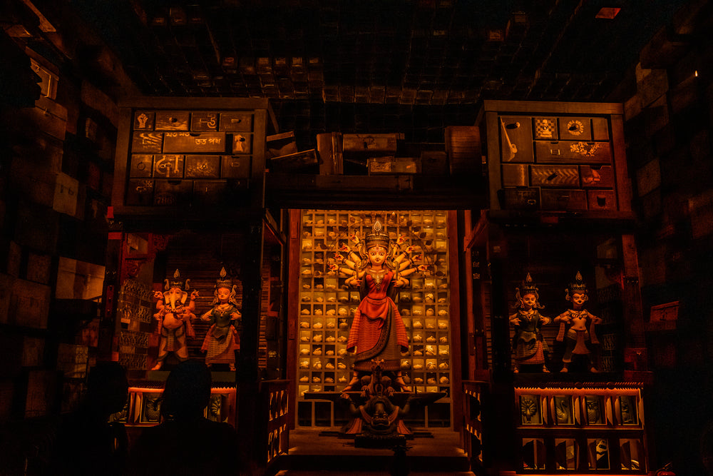 a hindu deity in a dimly lit temple