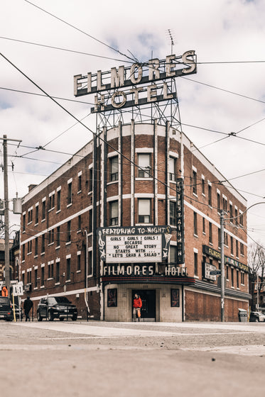 a hotel and nightclub on a street corner