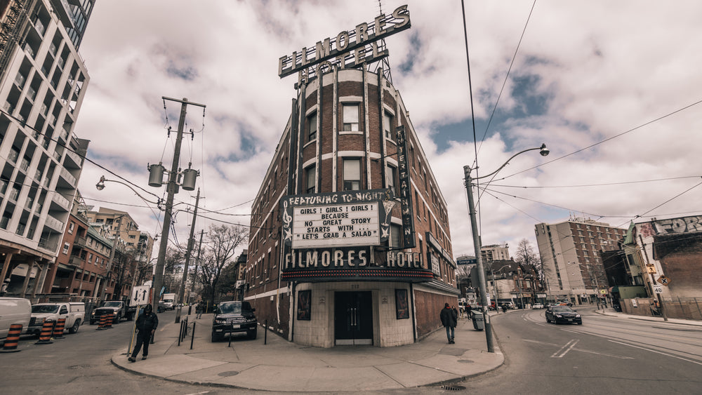 a hotel with night club on an urban street