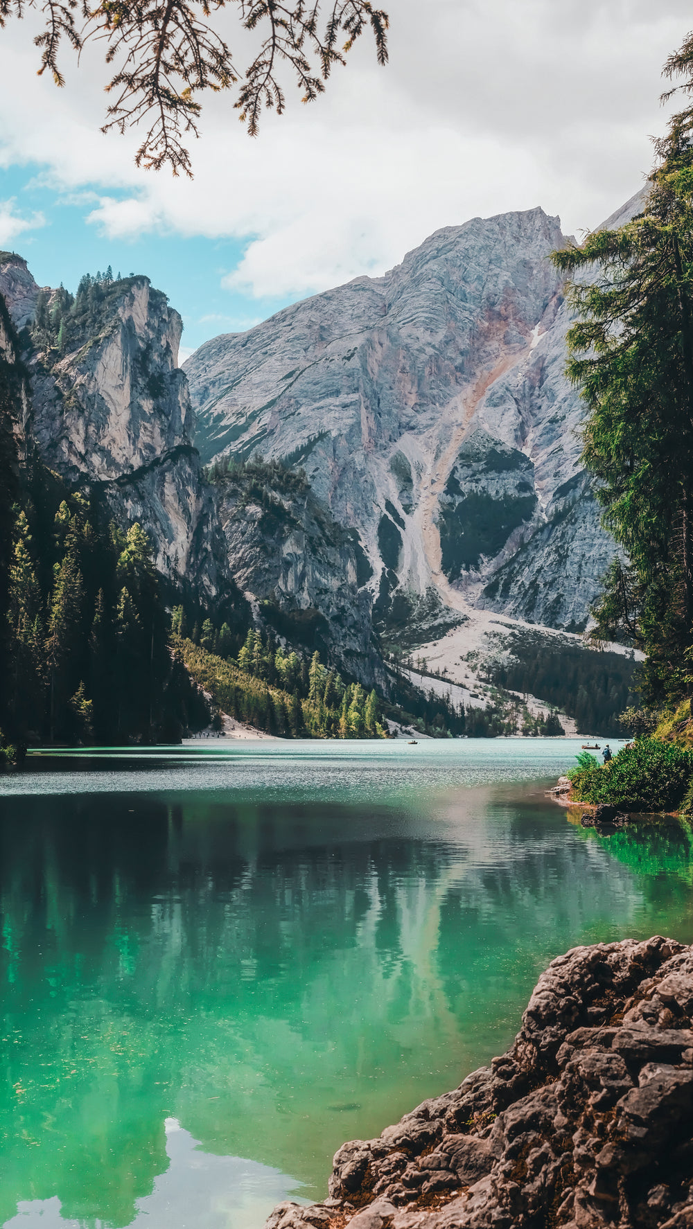 a lake side view of rocky mountains