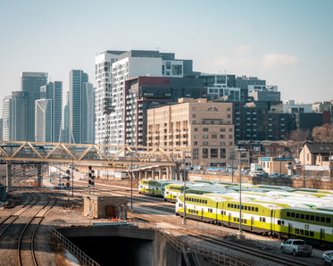 a large white bridge over a train station