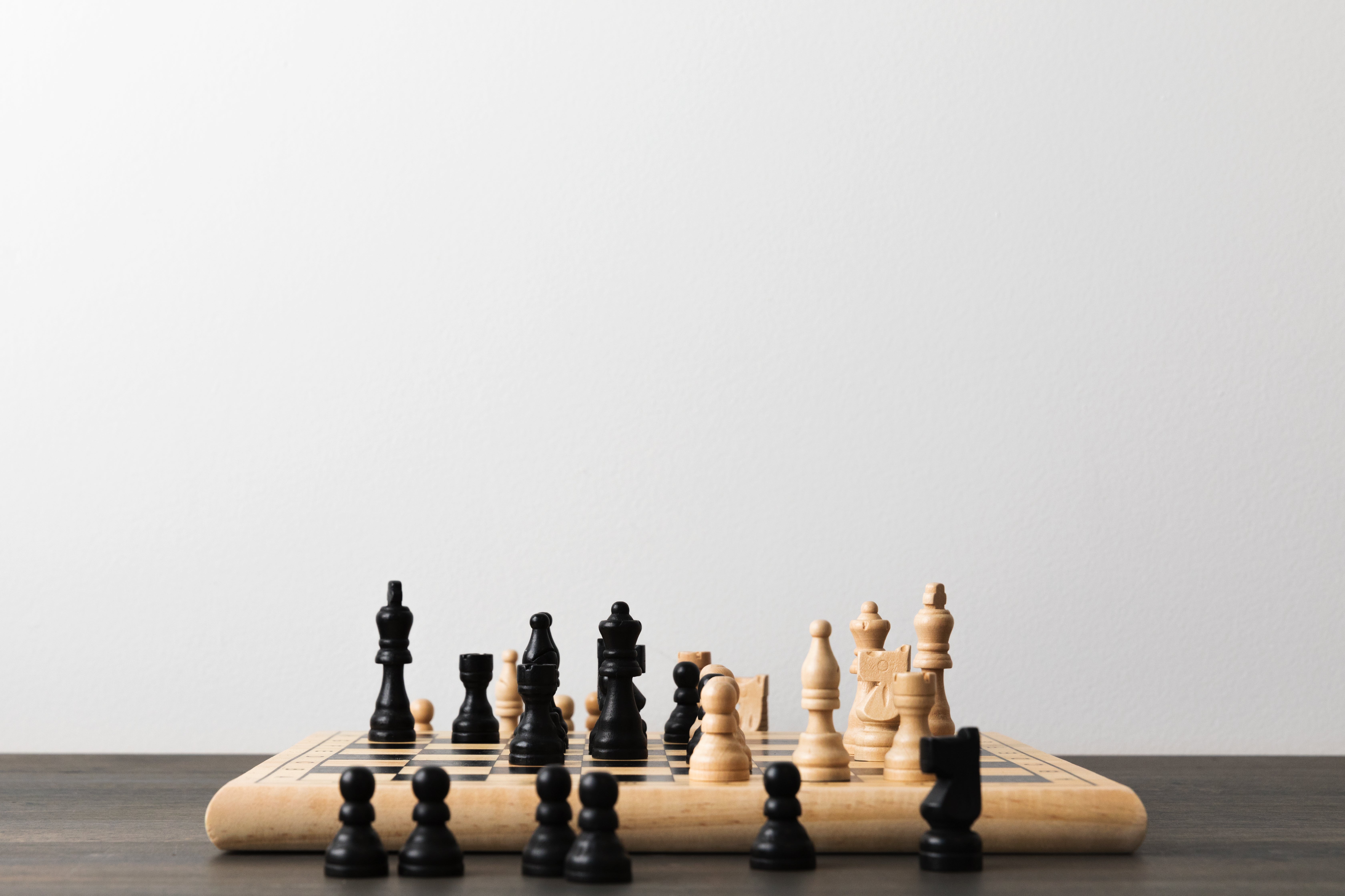 Browse Free HD Images of Dark Wooden Chess Pieces Against A Black Background