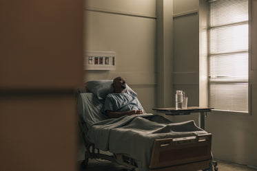 a male patient lying in hospital bed