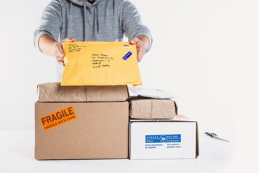 a man holding up packages for fulfillment