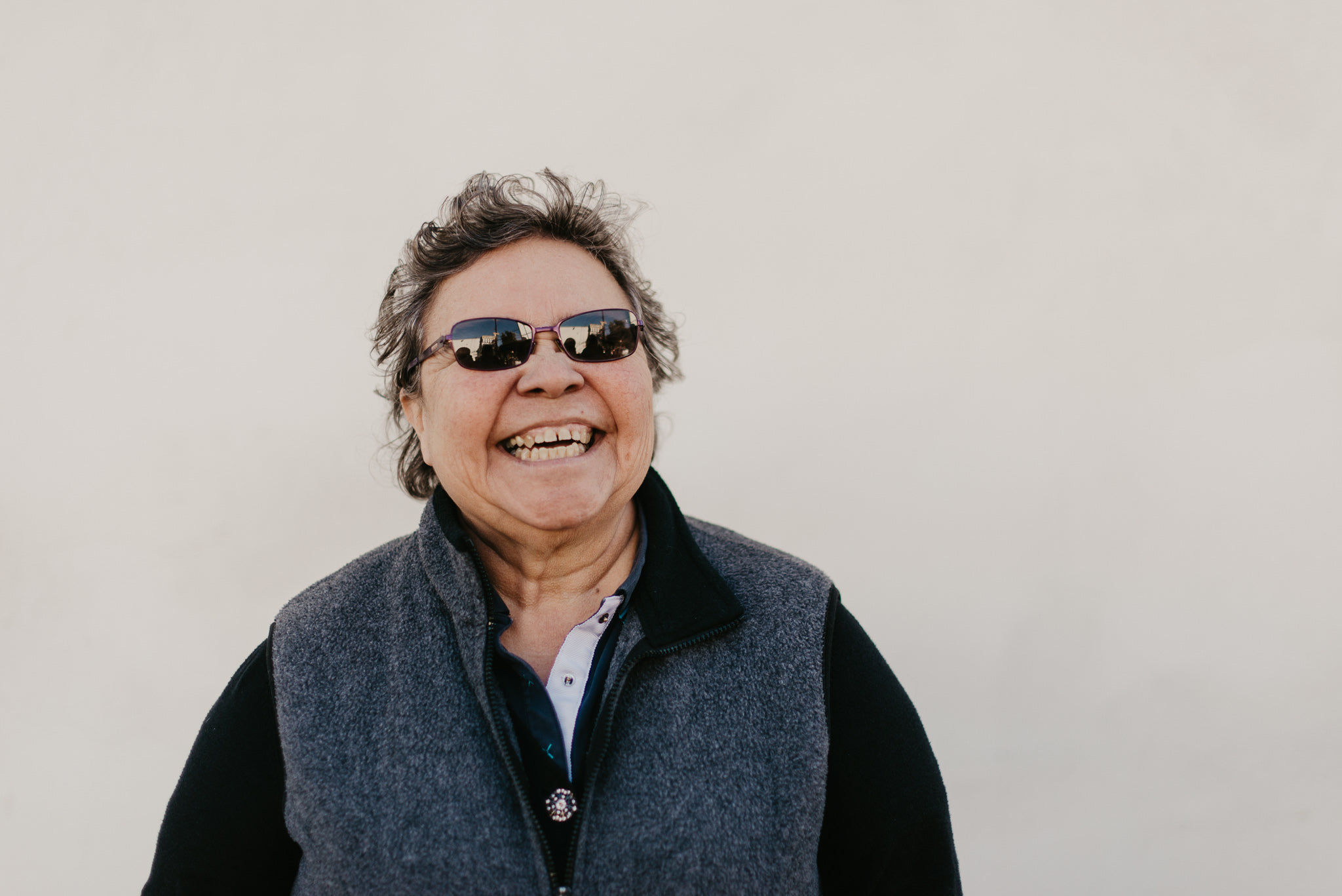 A Mature Woman With Sunglasses Laughing