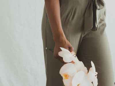 A Model In Khakis Holding Orchids