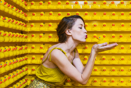 a model kisses rubber ducks in search of her prince charming