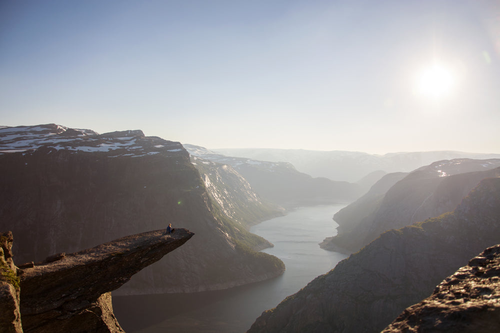 a mountain range with a river below