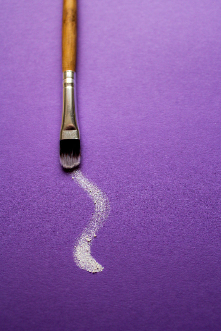 a-paintbrush-trails-white-paint-on-purple-paper.jpg?width=746&format=pjpg&exif=0&iptc=0