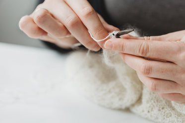 a pair of hands knitting