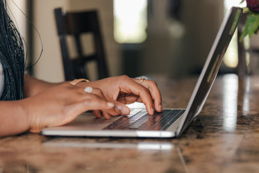 a pair of hands typing away