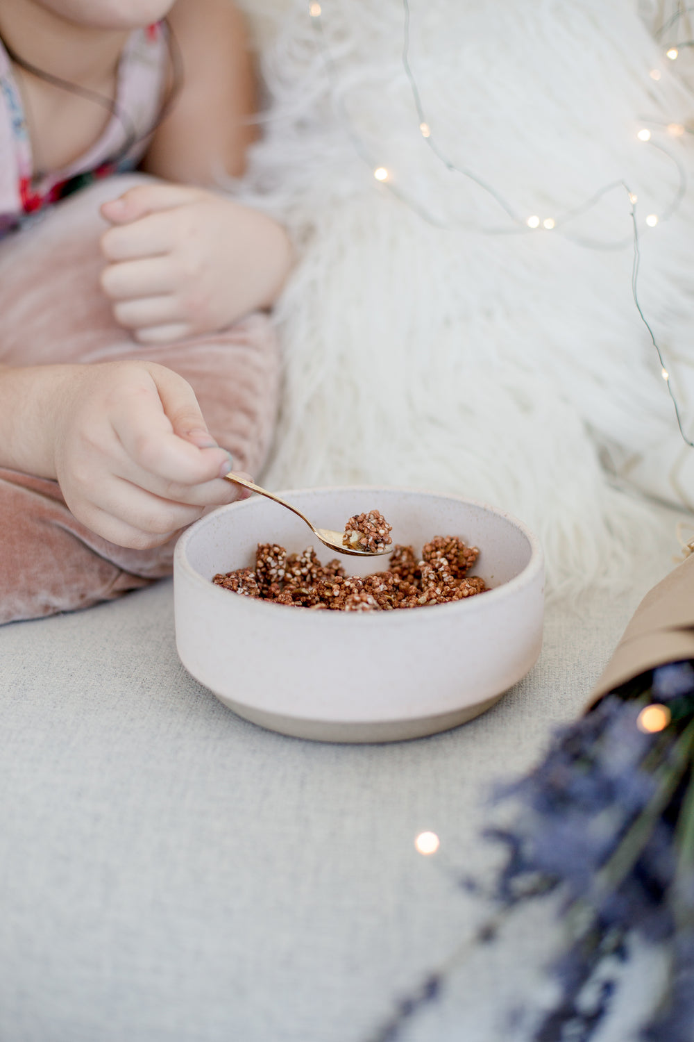 a person eats cereal on a couch