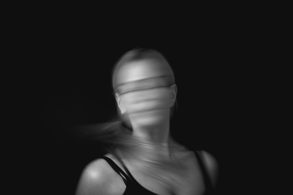 a person moving their head creating motion blur