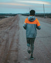a person out for a run on a dirt road