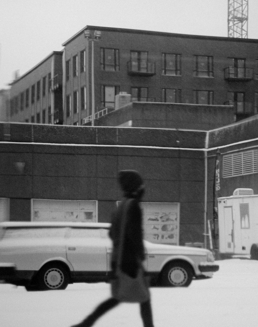 a person walking in a city in monochrome