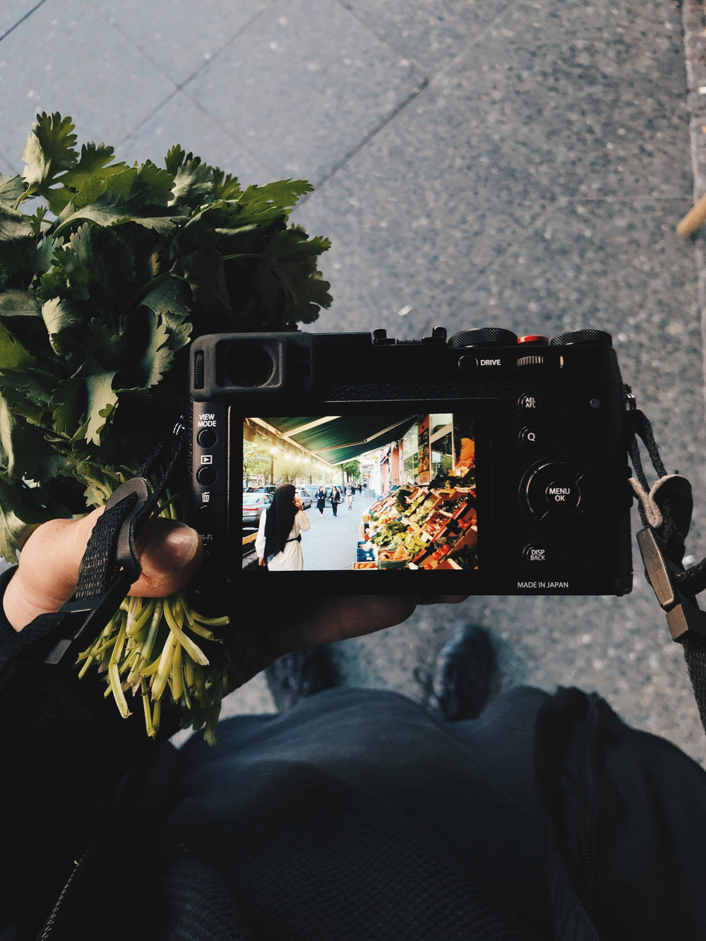 a picture of a produce stall through a camera screen