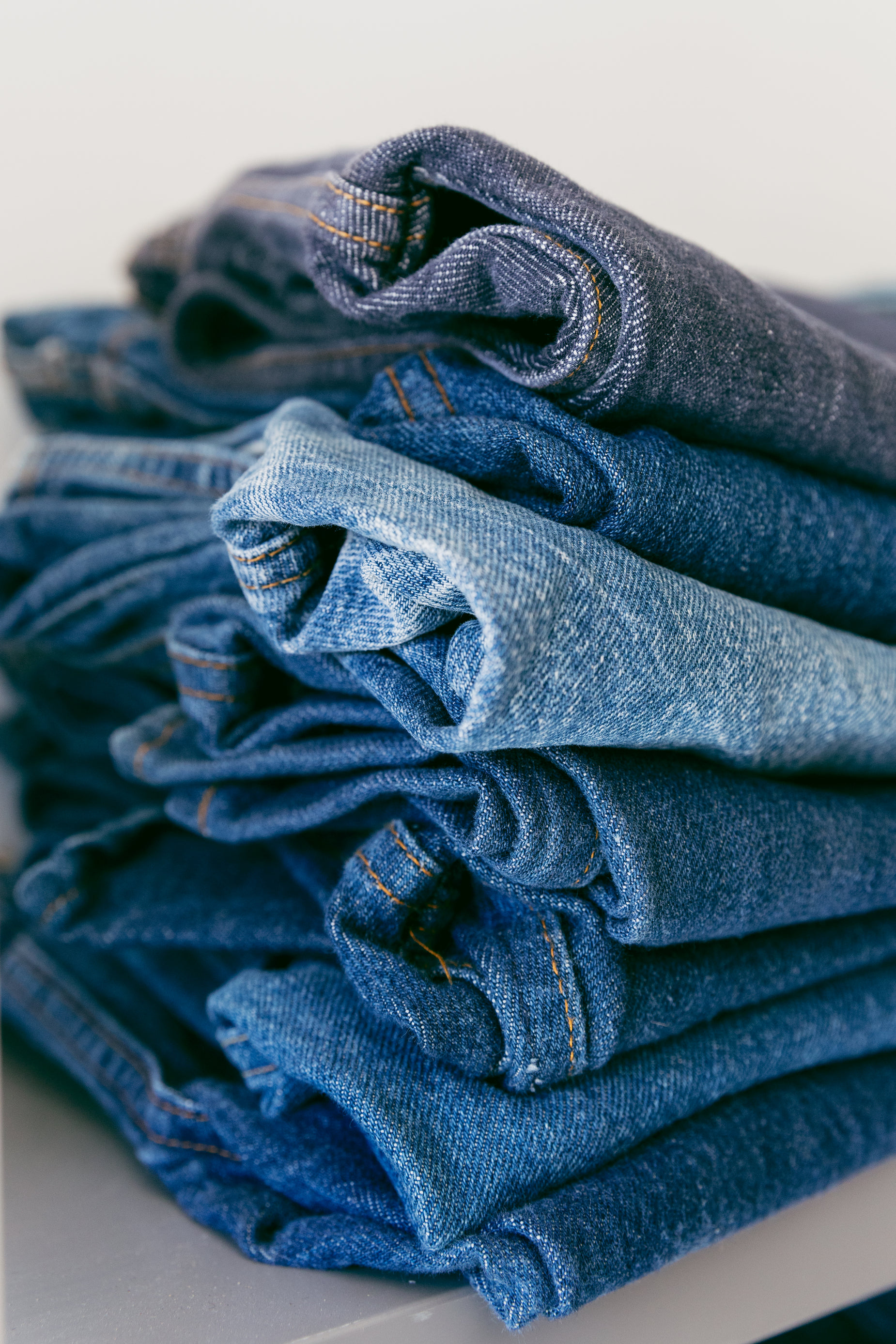 Browse Free HD Images of A Pile Of Denim Jeans In Different Shades Of Blue