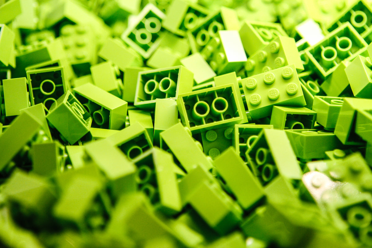 a pile of lime green lego blocks