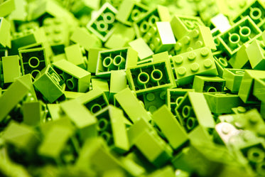 a pile of lime green lego blocks