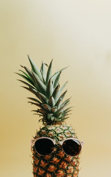 a pineapple wearing sunglasses